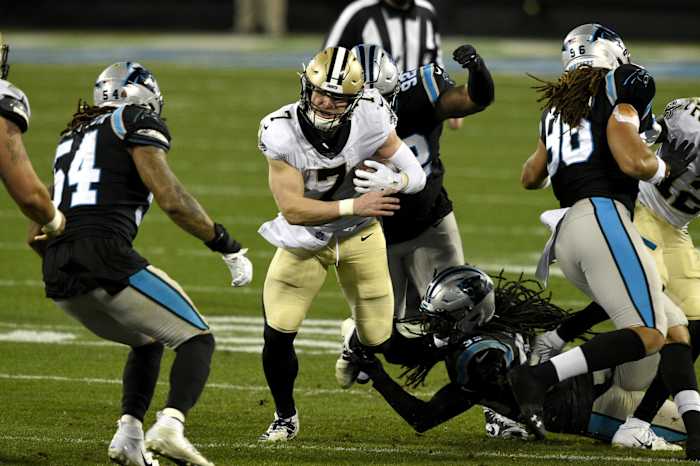 New Orleans Saints quarterback Taysom Hill (7) runs as Carolina Panthers outside linebacker Shaq Thompson (54) defends. Mandatory Credit: Bob Donnan-USA TODAY Sports